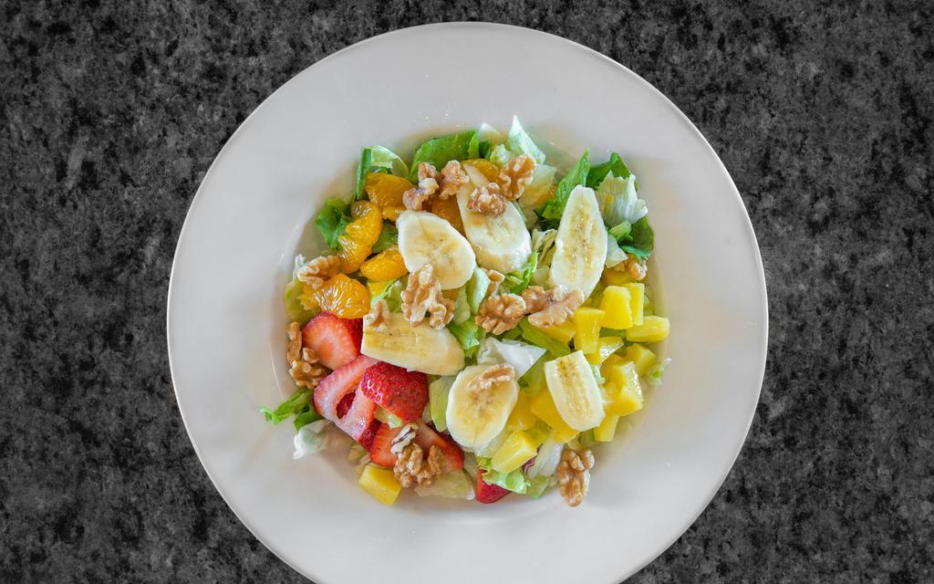 Pacific Fruit Salad · Mixed greens, fresh bananas, pineapple, strawberries, mandarin oranges and walnuts with grilled chicken breast served with raspberry vinaigrette.