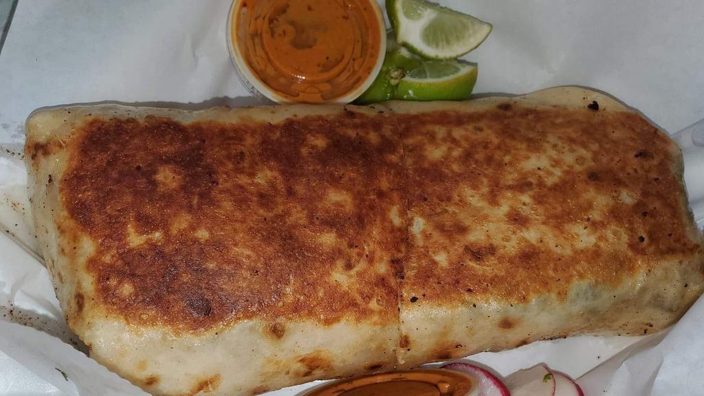 Burritos · Large Flour Torilla  with beans your choice of meat, lettuce,tomatoes,onion,cilantro,cheese and sour cream. served with lime and 2 salsas on the side(1 red and 1 green)