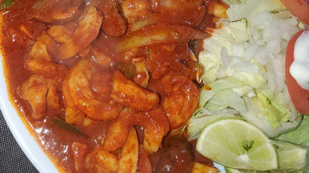 Camarones Ala Diabla · Shrimp with spicy sauce and onions, served with rice and order of tortillas.