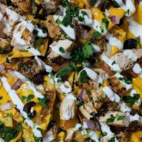 Loaded Layered Nachos · Chicken, black beans, cheese, cheese sauce, pickled jalapenos, onions, cilantro, black olive...