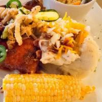 Hot Nashville Chicken Dinner · Two Nashville style breaded breasts, house made pickles topped with onion strings, jalapenos...