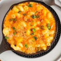 Mac N Cheese Dinner · Cavatappi pasta tossed with ham and smoked cheese cream sauce, topped with toasted bread cru...