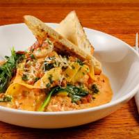 Tuscan Shrimp Tortellini Dinner · Shrimp, spinach, red onion, garlic, and cheese tortellini simmered in oven dried tomato crea...