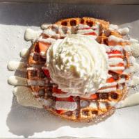 Strawberry Waffle · Strawberry flavored waffle, topped with strawberries, whipped cream, and powdered sugar.