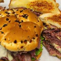 Motor City Corned Beef · Triple Decker with 3 Grilled Rye with Corned Beef, swiss cheese, coleslaw and 1000 Island wi...