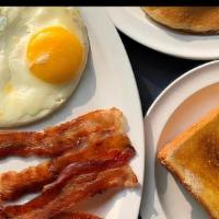 Regular Breakfast · Choice of Meat, 2 Eggs, Hashbrowns or Grits with Toast