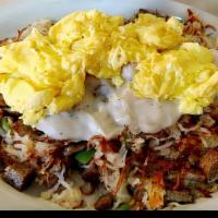 Corned Beef Hash & Eggs · Corned beef hash with green peppers and onions, served with toast and jelly.