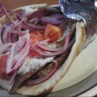 Gyro · With tomatoes, onions, and gyro sauce.