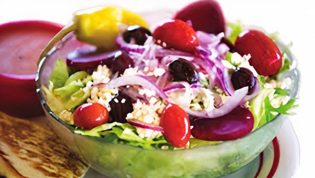 Greek Salad · Tomatoes, onions, cucumbers, beets, olives, feta cheese and pepperoncini with Pita Bread