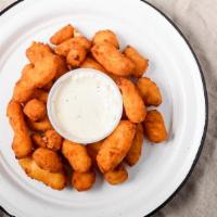 Basket Of Cheese Curds · Lightly breaded Wisconsin white cheddar cheese curds served with a side of home-made ranch.