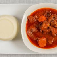Goat Meat Stew · Served with white rice or fufu.