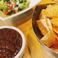 Chips / Salsa · Unlimited fresh white corn chips and fire roasted tomato salsa.