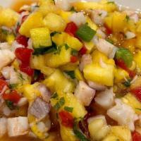 Mango Ceviche · Shrimp with lime, mango, pineapple, roasted red peppers with fresh white corn chips.