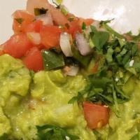 Guacamole · Freshly smashed avocado with jalapeño, tomato, onion, cilantro and lime with fresh white cor...