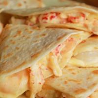 Cheese Only Quesadilla · Lettuce, sour cream & a slice of tomato on the side.