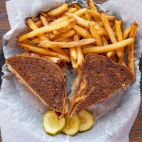 Robert'S Famous Reuben · Corned beef on marble rye with sauerkraut swiss cheese, thousand island dressing and Dusseld...