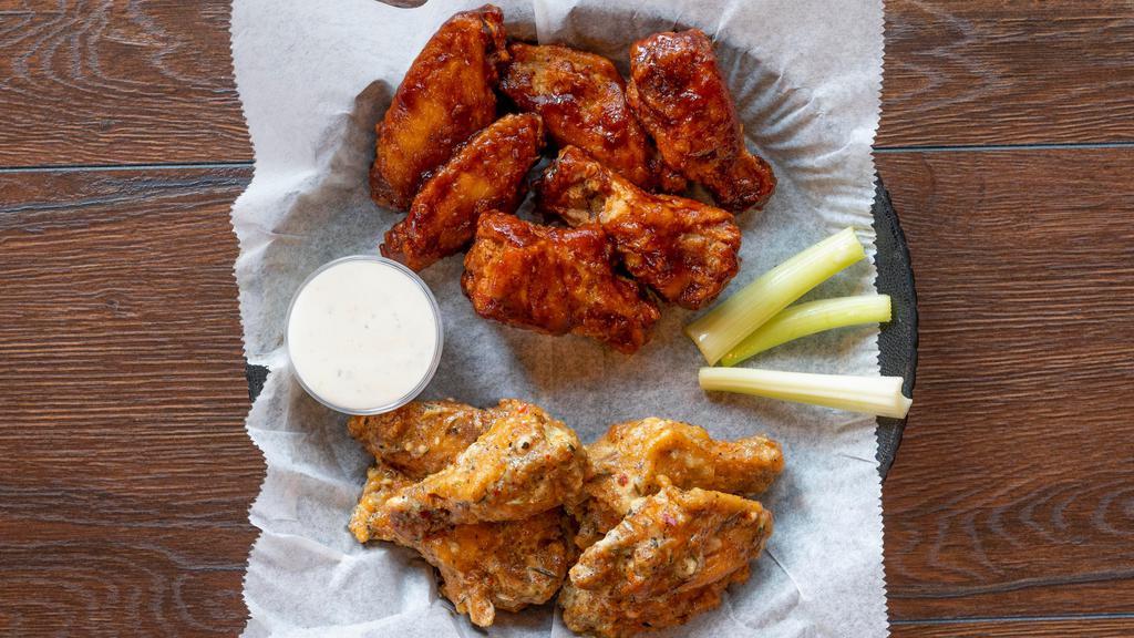 6  Wings With Bones · All wings served with celery, your choice of ranch or blue cheese, and your choice of sauce.
6 wings get one flavor choice, 12 wings get up to 2 flavor choices.