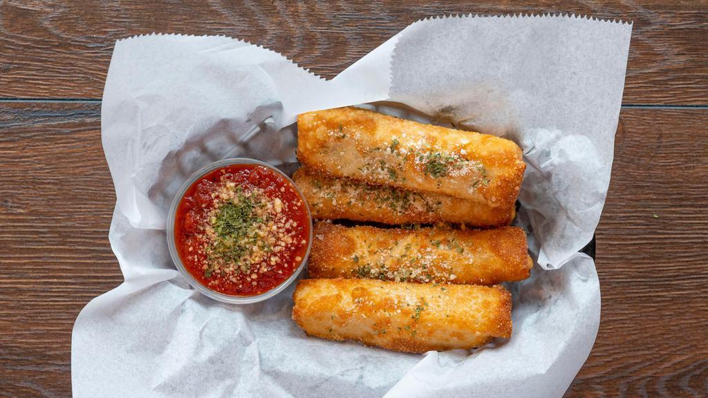 Hand Rolled Cheese Sticks · Mozzarella and cheddar hand rolled in wonton skins, deep fried and dusted with parmesan.