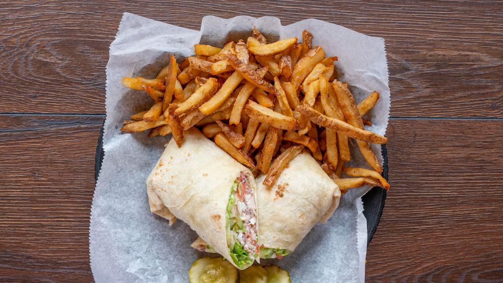 Chicken Bacon Ranch · Grilled breast of crispy chicken, bacon, mozzarella cheese shredded lettuce & tomato with ranch dressing, served with hand-cut French fries.