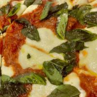 Margherita Pizza · Fresh basil, fresh mozzarella topped with olive oil and Parmesan cheese