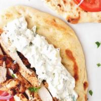 Chicken Gyro · Chicken Gyros  the classic Greek  sandwich, with meat cut from a spit, wrapped in a pita, on...