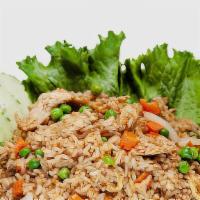Kow Pad · Thai-style fried rice with eggs, onions, peas and carrots. Served with your choice of chicke...