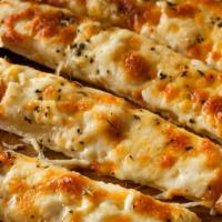 Cheese Breadsticks · Homemade, freshly baked breadsticks topped with golden, browned cheese.