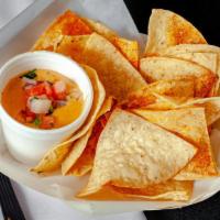 Chips & Queso · Queso Cheese, Tortilla Chips.