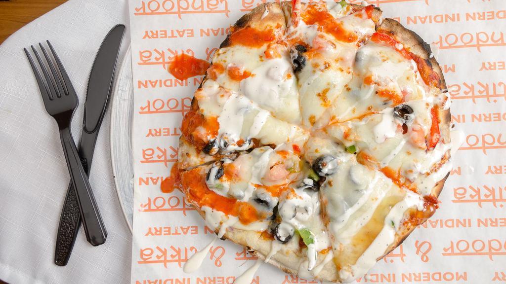 Paneer Naan Pizza · Fresh Naan base, Paneer (protein-rich), flavored with a curry of your choice, and topped with your favorite fresh veggies of your choice and mozzarella cheese! Sauce it to your taste buds!