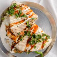 Paneer Naanwich · Fresh baked naan as the bread, topped with Paneer (Indian Cheese), flavor it with a curry of...