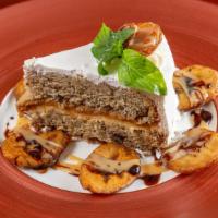 Pastel De Platano · Banana cake with pecan and cream cheese served with fried plantains.