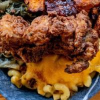 Southern Hospitality  · Mac and cheese, greens, candied yams and fried chicken. Cornbread & Sauce Included
