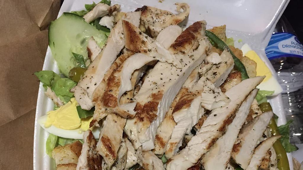 Grilled Chicken Salad · Grilled chicken, tomatoes, cucumbers, croutons and choice of dressing.