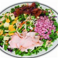 Chef Salad · Chopped smoked turkey, ham, bacon, American & Swiss cheese on a bed of fresh greens