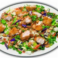 Oriental Chicken Salad - Crispy Or Grilled · Fresh salad blend, Asian style crunchy noodles, peanuts with your choice grilled or crispy c...