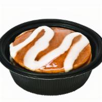 Cinnamon Pancakes · Three buttermilk pancakes served with cinnamon glaze, vanilla icing and syrup