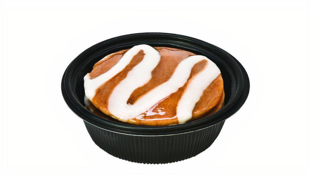 Cinnamon Pancakes · Three buttermilk pancakes served with cinnamon glaze, vanilla icing and syrup