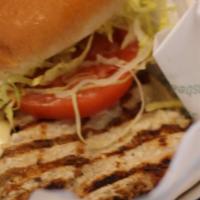 Grilled Chicken Sandwich · Our chicken breast is tenderized and seasoned, then grilled and  with lettuce, tomatoes and ...