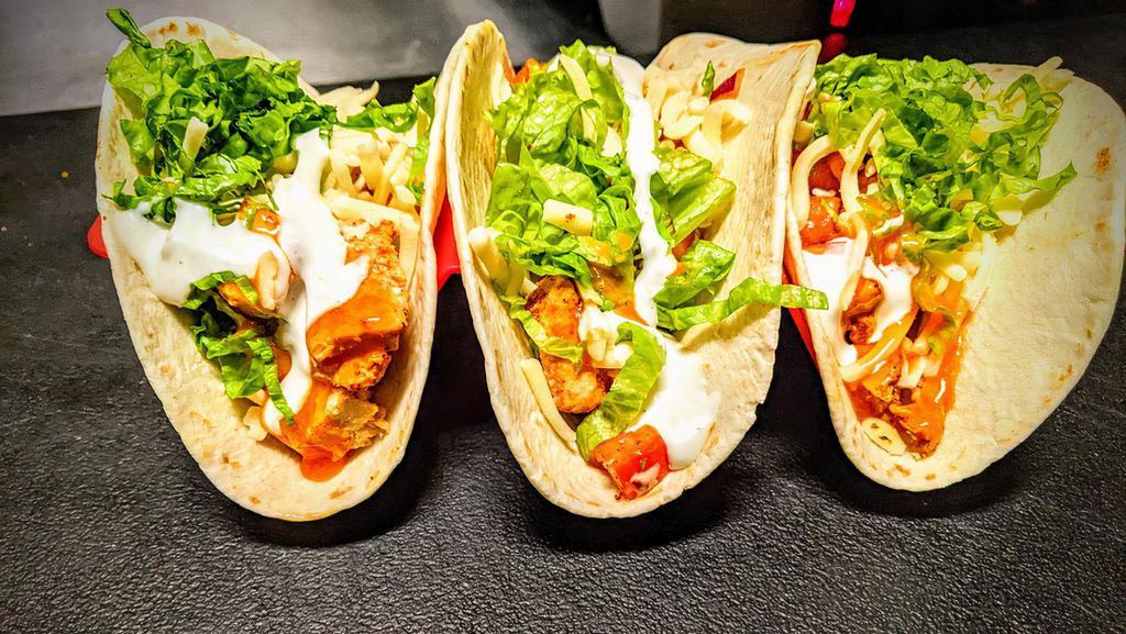 Buffalo Chicken Tacos · Roasted chicken breast, spicy buffalo sauce, fresh pico de gallo, ranch dressing, shredded cheese and green leaf lettuce