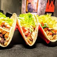 Black Bean & Brown Rice Tacos · Seasoned bean and rice blend with shredded cheese, fresh pico de gallo, leaf lettuce, and yo...