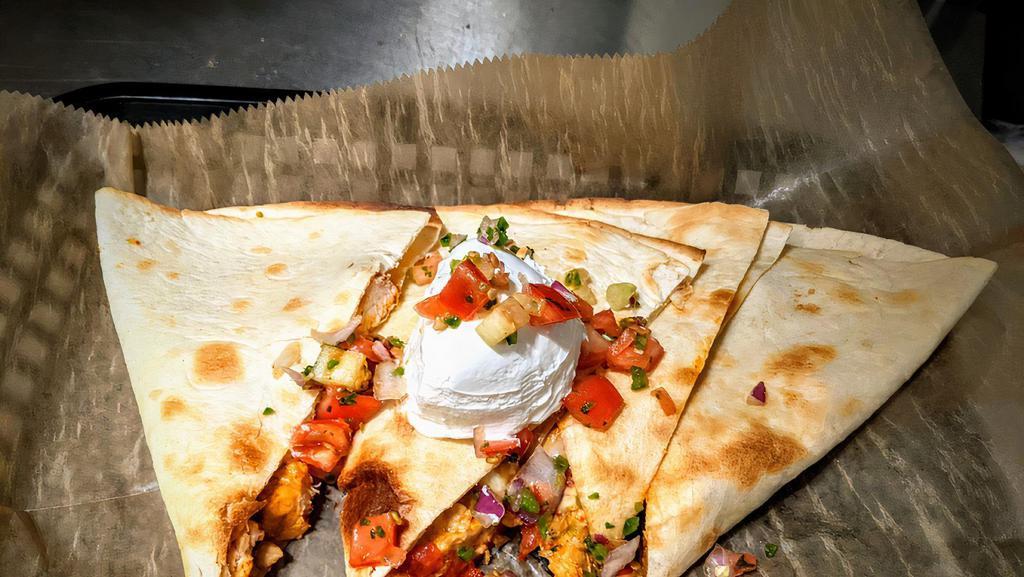Chicken Quesadilla · Served with salsa and sour cream