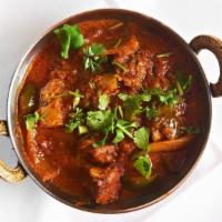 Bheda Ko Masu (Lamb Curry) · Boneless pieces of lamb slowly cooked in a light tomato curry sauce.