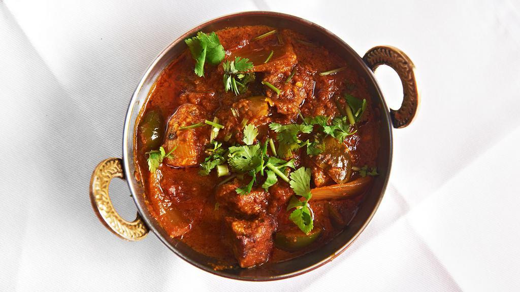 Bheda Ko Masu (Lamb Curry) · Boneless pieces of lamb slowly cooked in a light tomato curry sauce.