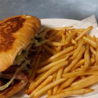 Tortas · Choose your meat. Served with lettuce tomatoes and onion / Escoja su carne. Servido con lech...
