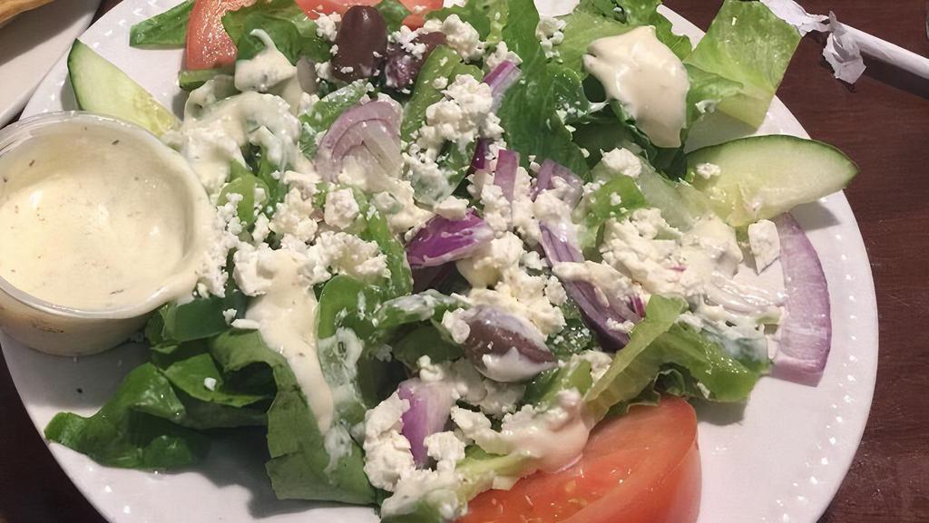 Greek Salad · Vegetarian. Gluten Free. Romaine lettuce, tomatoes, cucumbers, red onions, green peppers, and feta cheese with our homemade creamy garlic dressing.