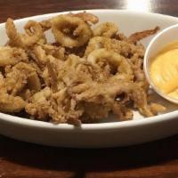 Calamari · Spicy. Deep Fried served with our spicy sauce.