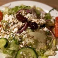 Greek Salad · Hearts of romaine, baby spinach, red onions, Kalamata olives, feta cheese, grape tomatoes, c...