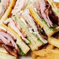 Club · A triple-decker with layers of turkey, ham, lettuce, mayo, bacon, tomato, Swiss cheese, and ...