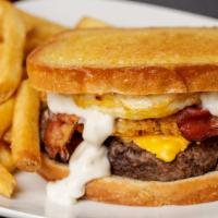 Anytime · Melted American cheese, crispy hash brown patty, country style gravy, bacon, and an egg on g...