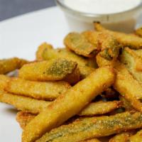 Pickle Fries · Sliced pickle spears battered and fried.